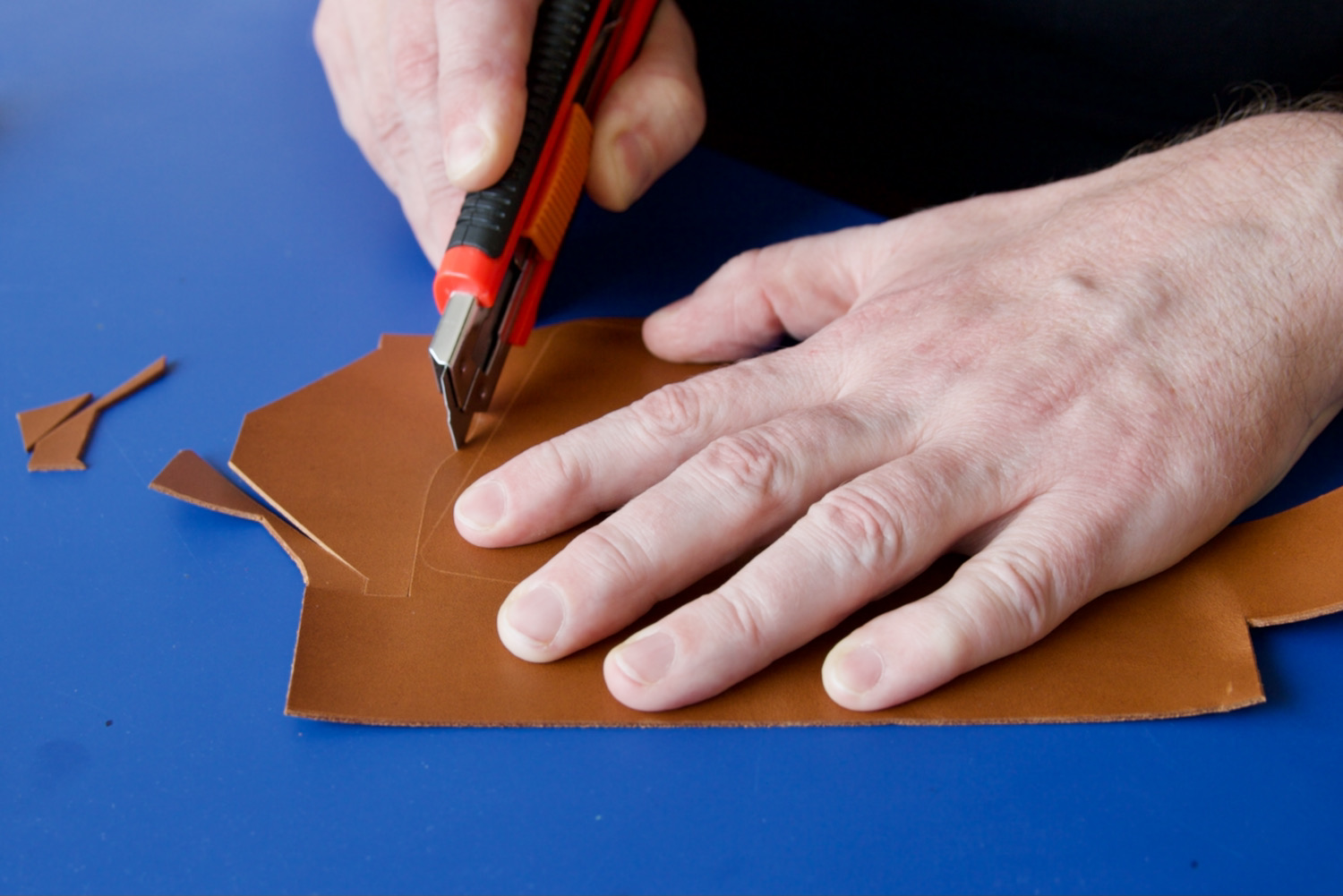 cutting out leather pieces