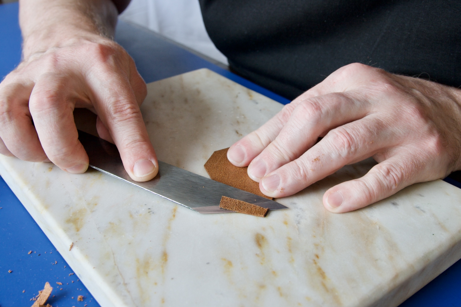 leather craftsman with skiving knife