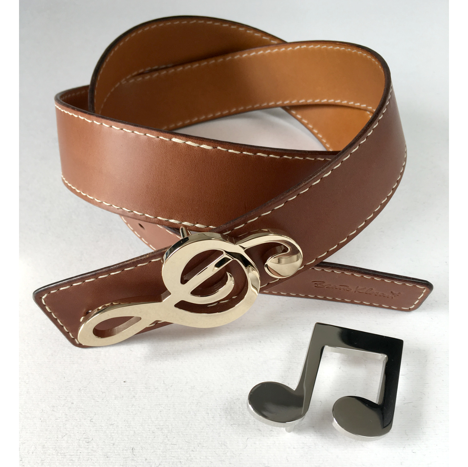 leather belt with two brass musical buckles