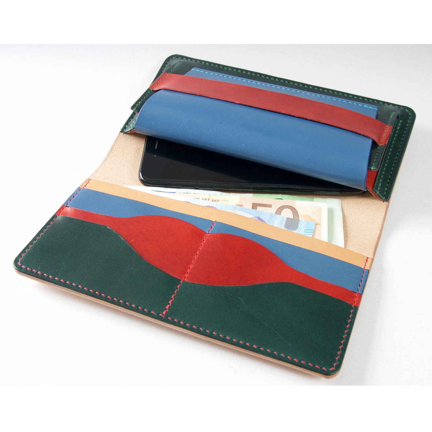 leather clutch envelope with mobile and bank notes inside