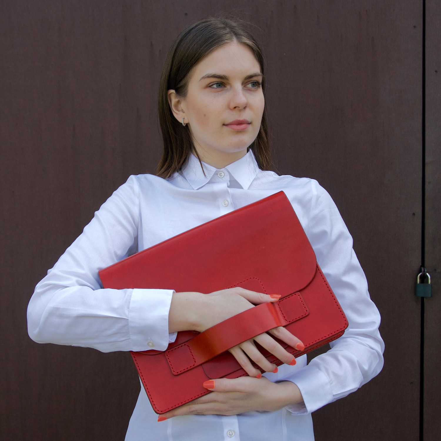 model holds leather document case