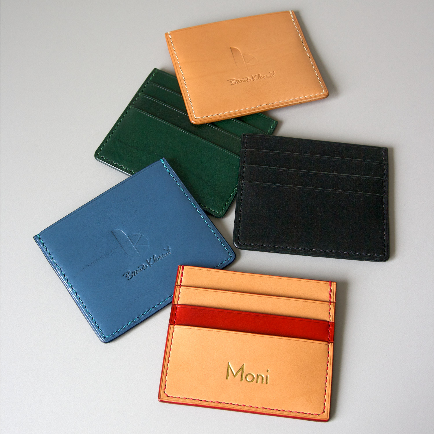 leather cardholders lying on table