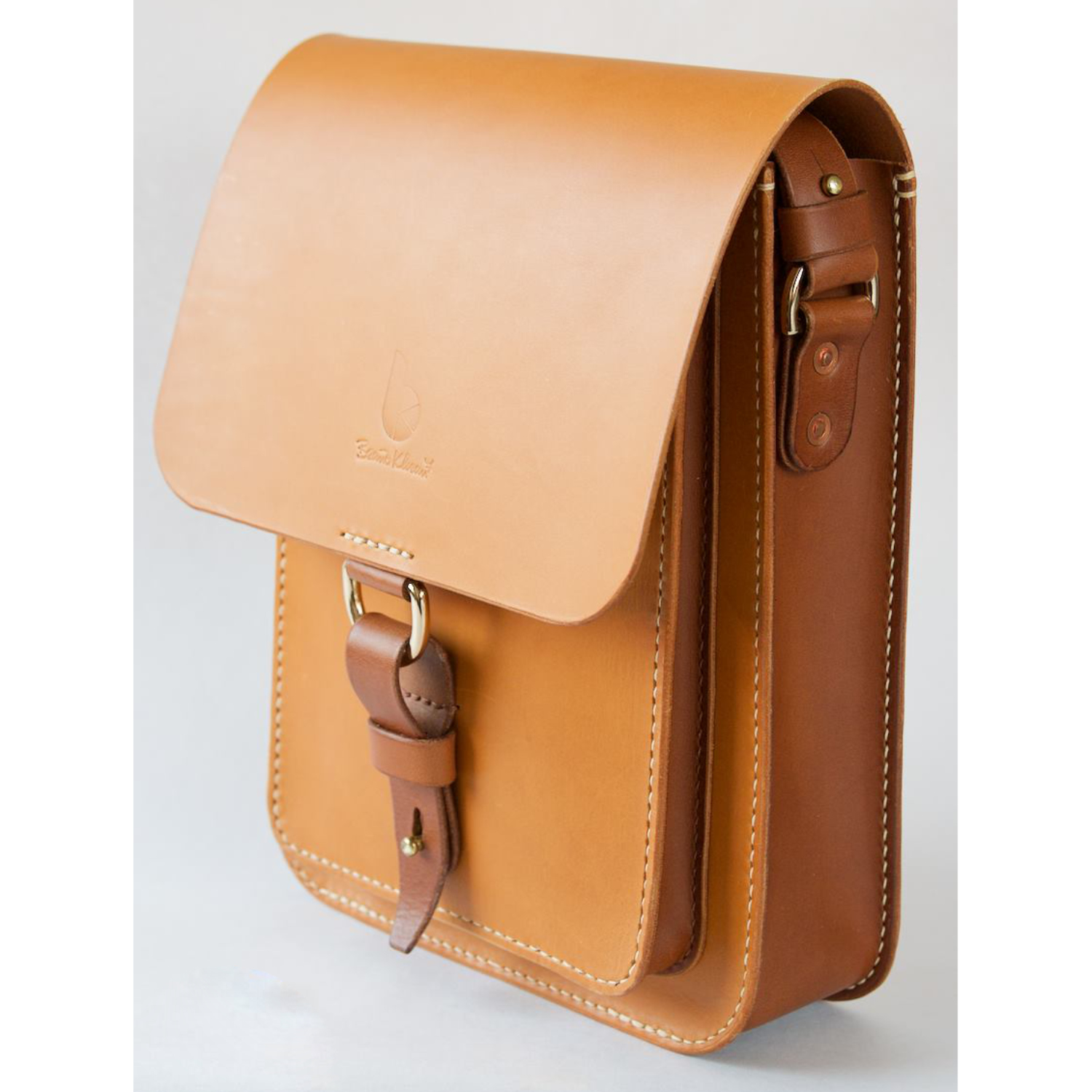 leather messenger bag with strap and dring closure