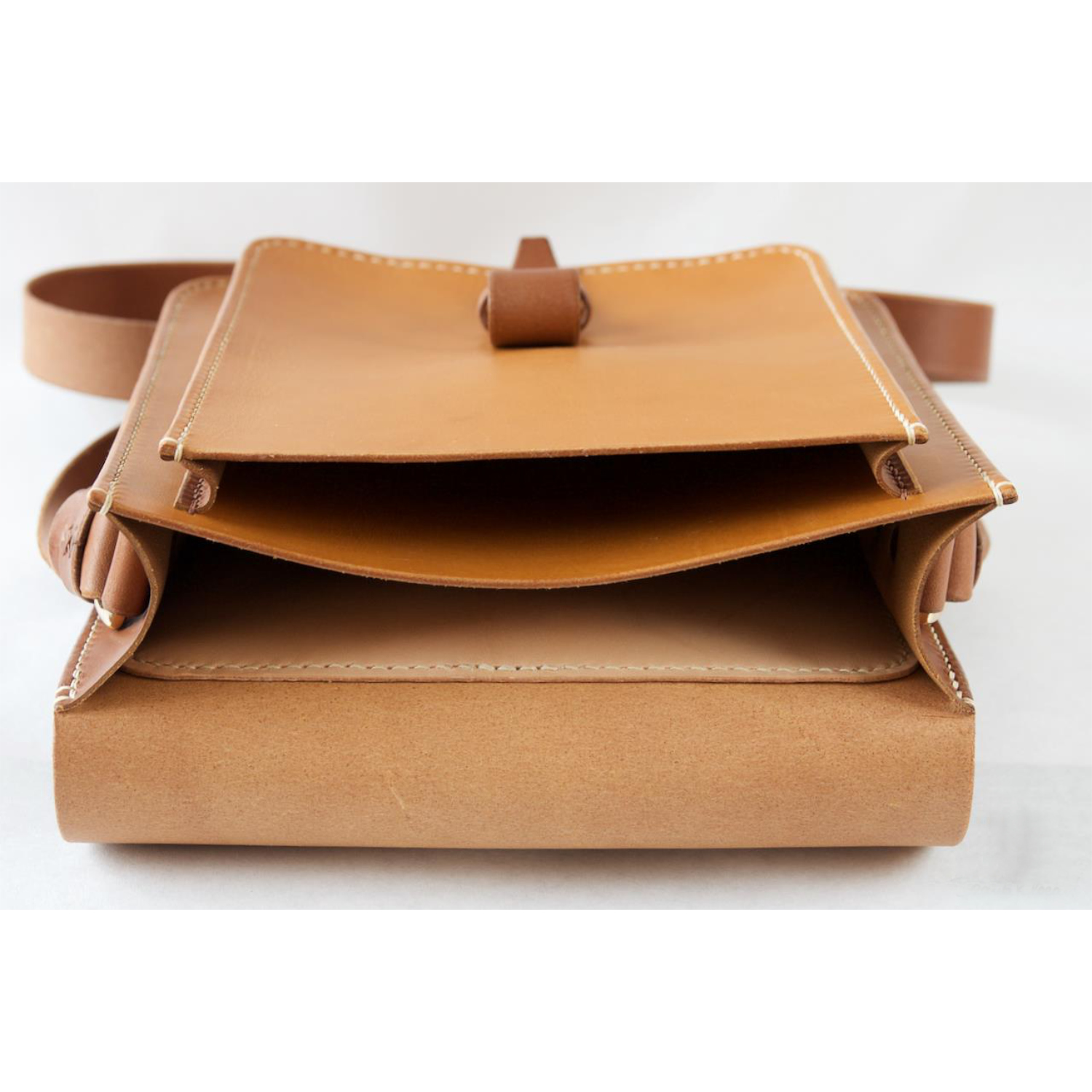 leather messenger bag with strap and dring closure inside view