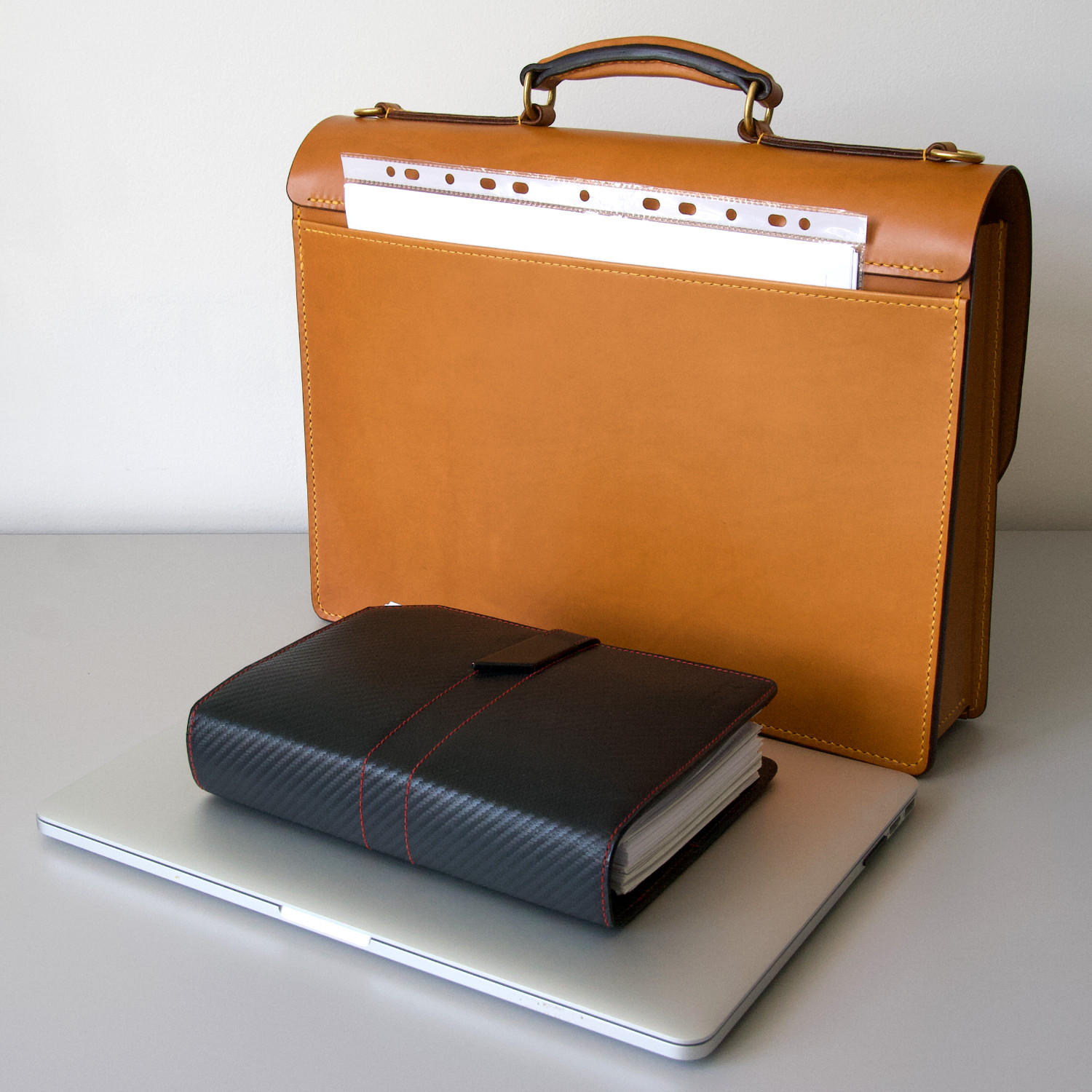 leather briefcase with notebook and diary in front