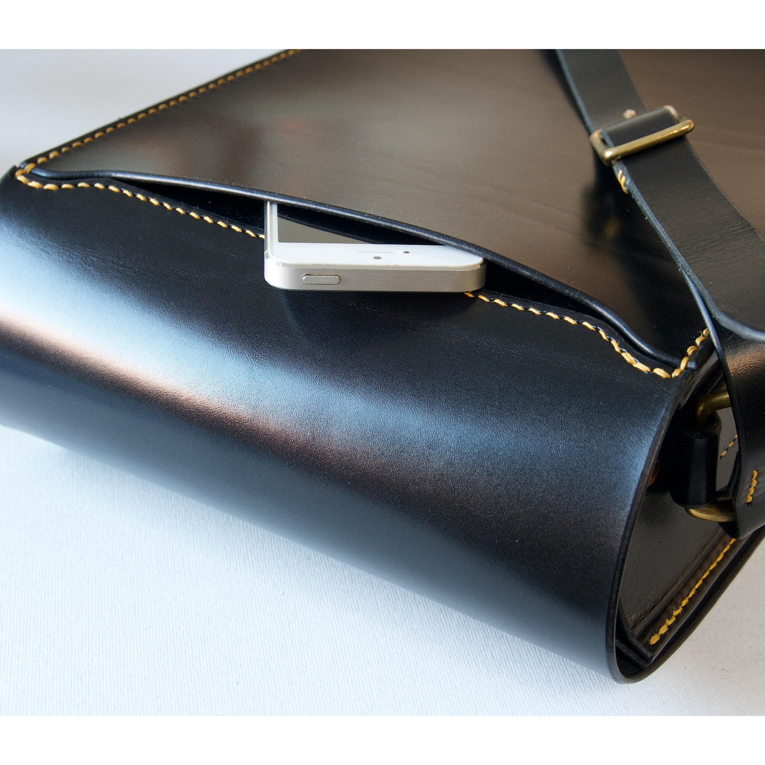 black leather messenger bag rear pocket